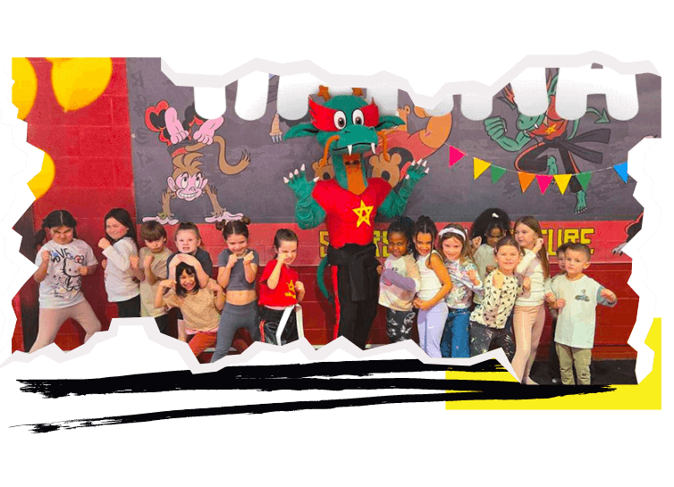 A birthday party with a group of children in fighting poses surrounding a dragon mascot