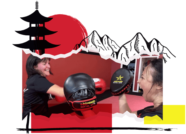 Two women training, one with boxing gloves throwing a punch at the other who is wearing pads