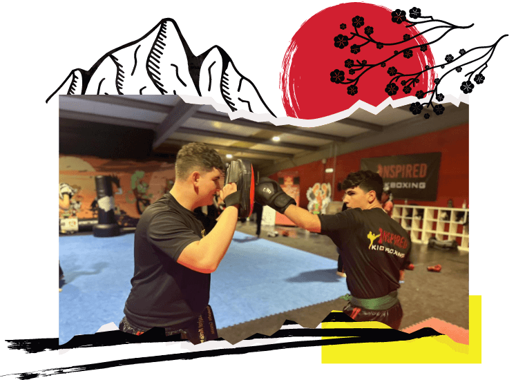 Two men training with boxing gloves and pads